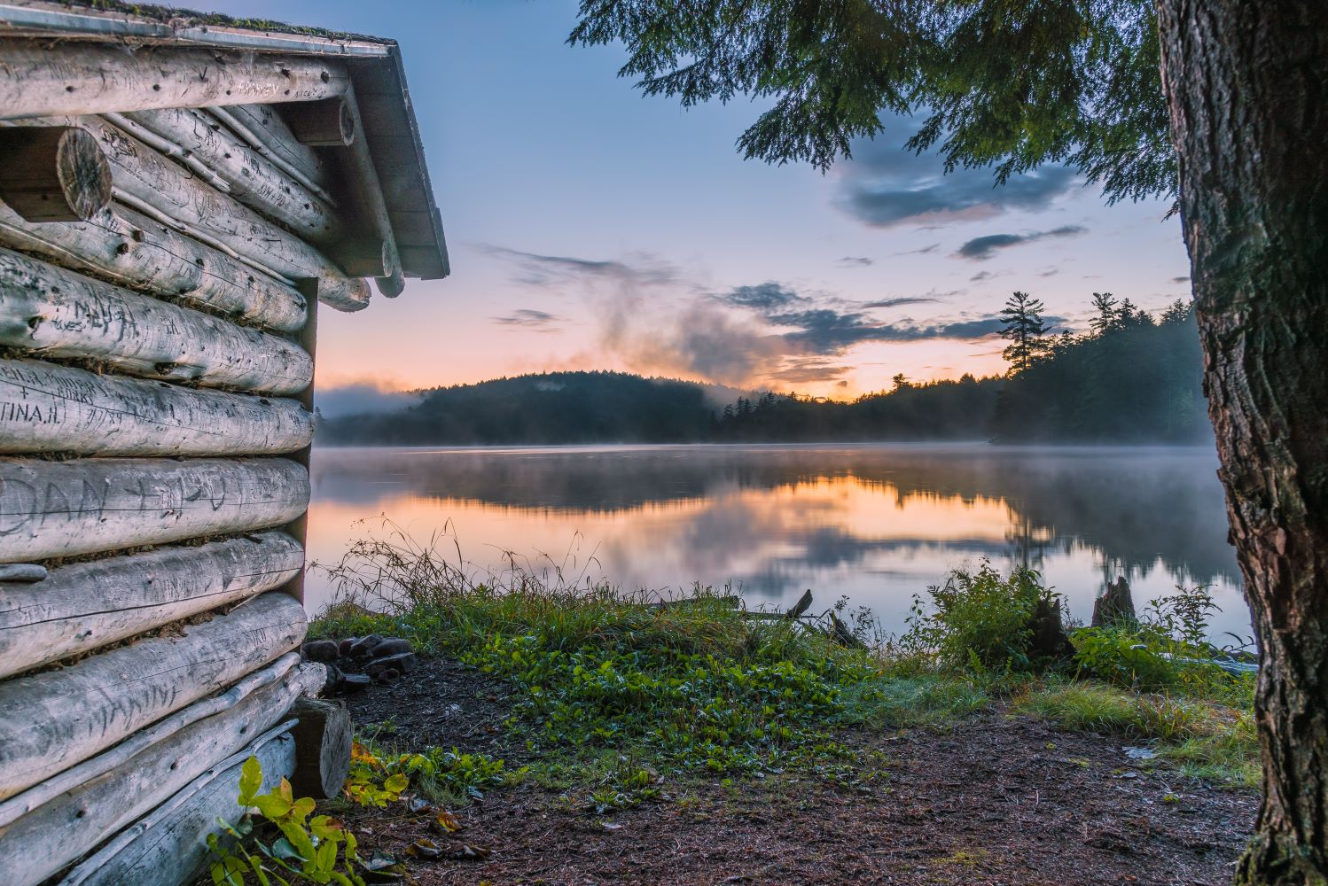 lean-to overlooking a lake in the woods