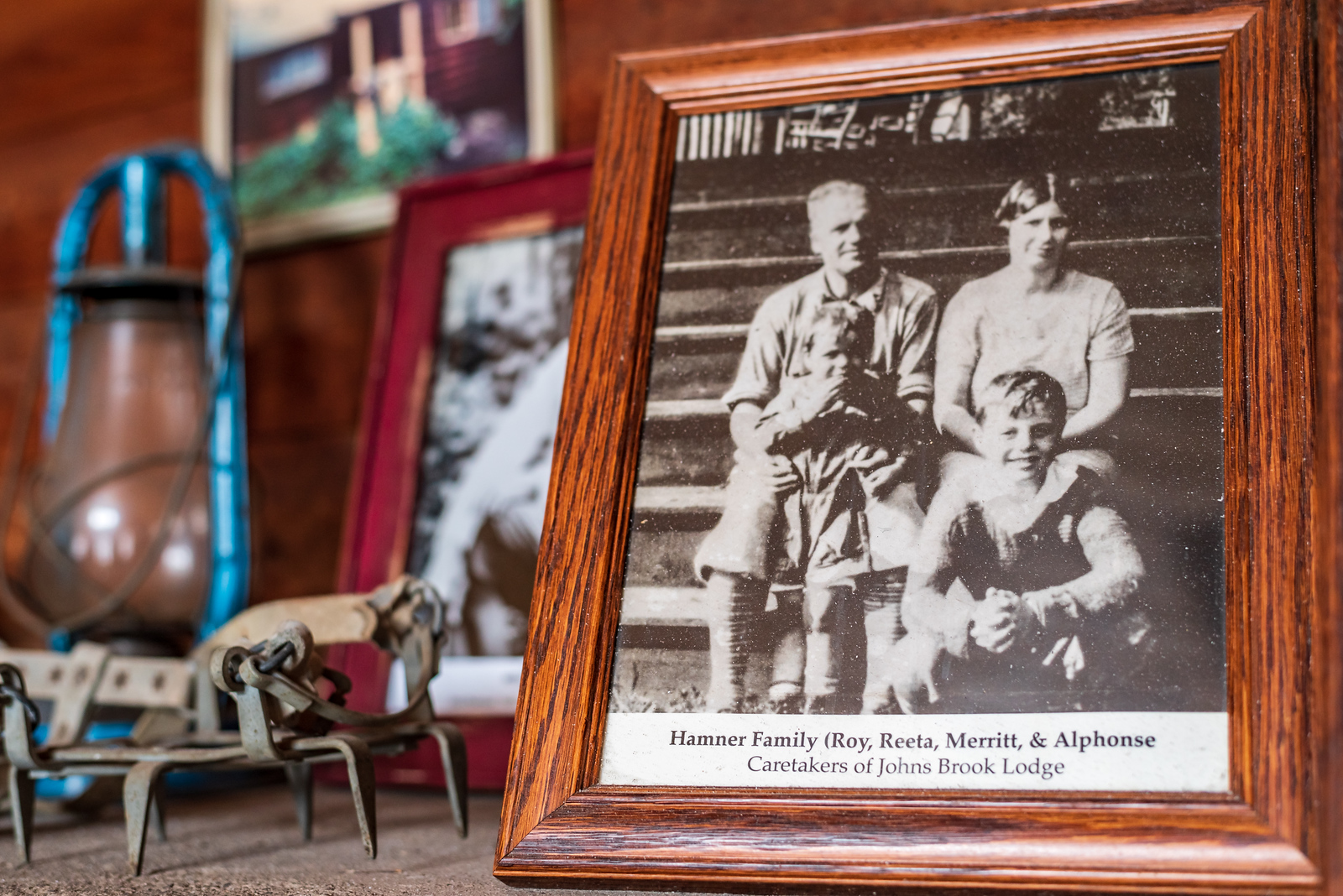a black and white family photo on a wooden table